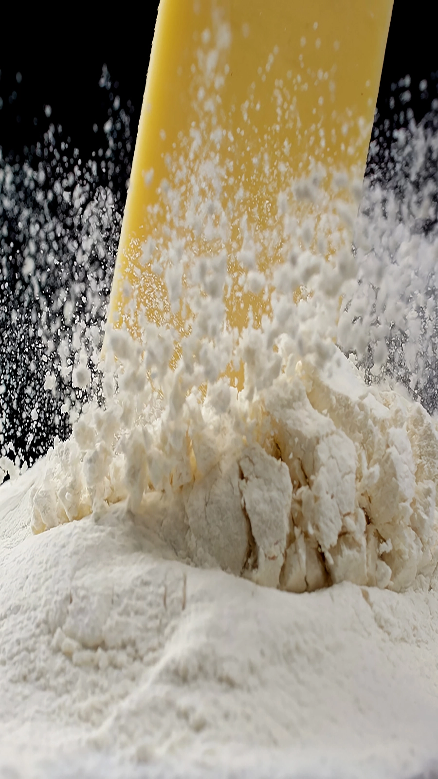 Flour impact slow-motion test created with controlled tabletop rigging for food cinematography.