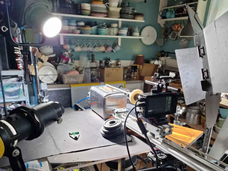 Behind the scenes tabletop rigging setup for slow-motion food and beverage visuals